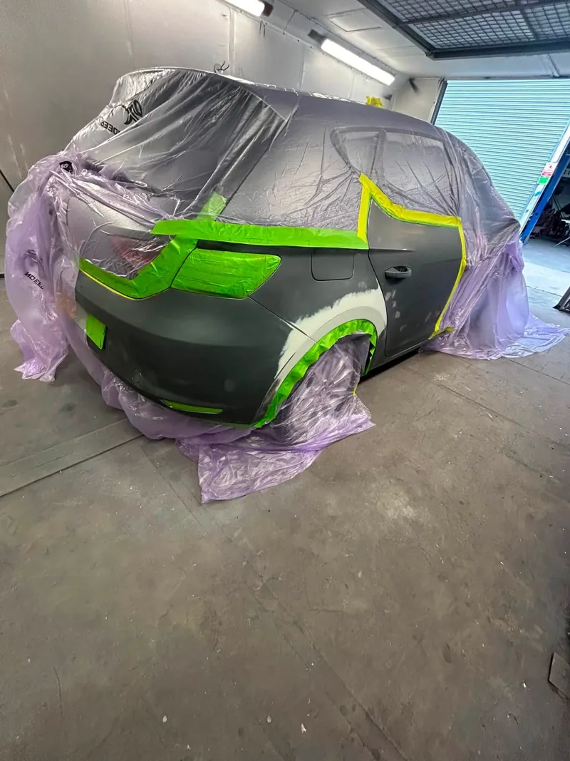 Rear quarter panel masked and prepped for paint